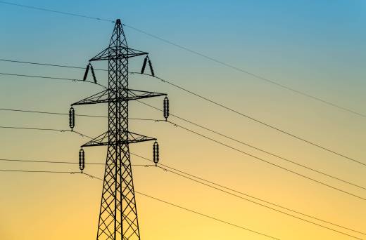 Shot of an electric tower during a sunset.